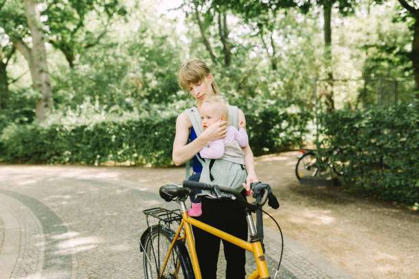 her baby in baby carrier at Prenzlauer Berg,