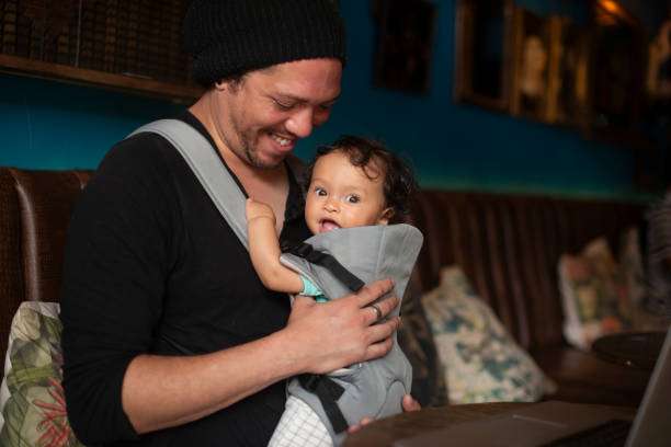 father with baby in cafe for freelance carrier