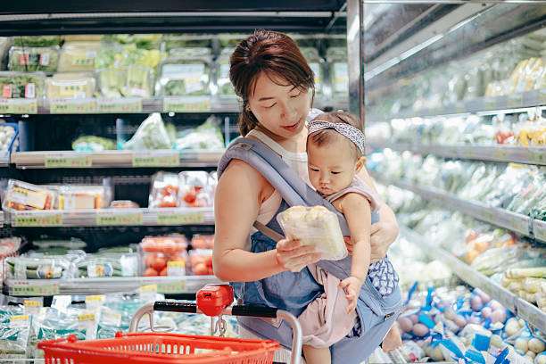 her baby girl comfortably in a baby carrier
