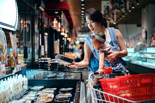 carrying her baby girl comfortably in a baby carrier