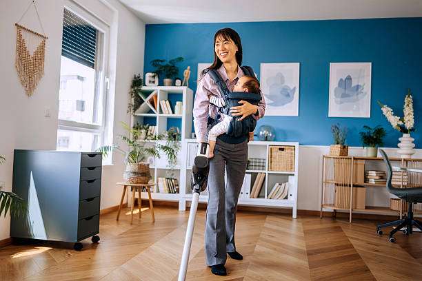 carrying her baby girl comfortably in a baby carrier