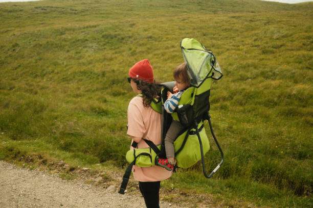 son in a backpack baby carrier during a hike overlooking Crater Lake in Oregon.