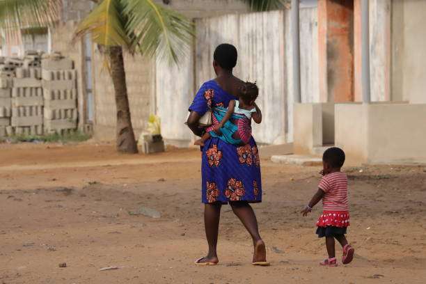She carries her baby on her back.baby carrier